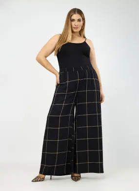 Pantalón vaporoso de cuadros en negro